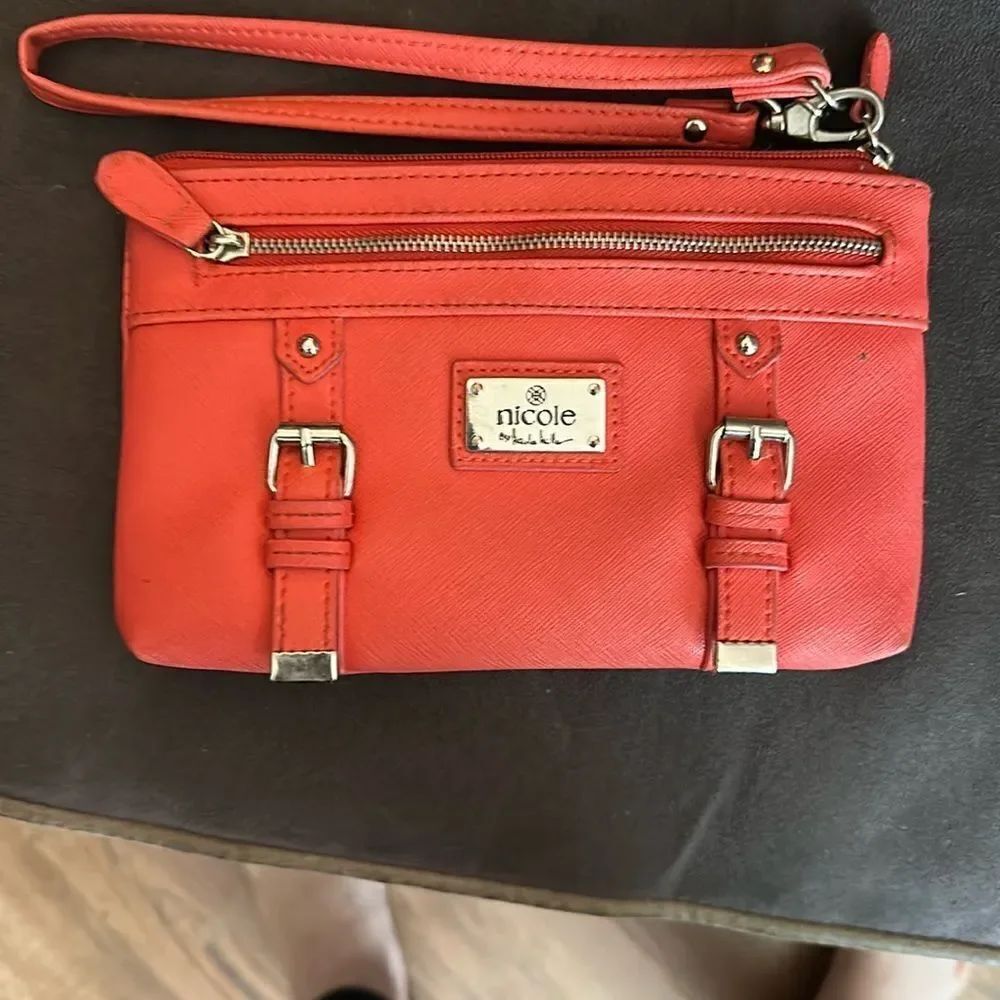 Nicole by Nicole Miller salmon colored Wristlet with Gold Details